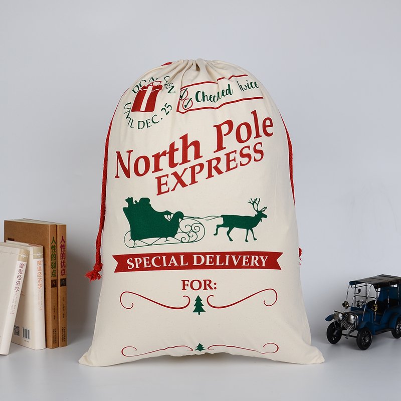 V474-16795-101168-00 50x70cm Canvas Hessian Christmas Santa Sack Xmas Stocking Reindeer Kids Gift Bag, Cream - North Pole Express - Image 1