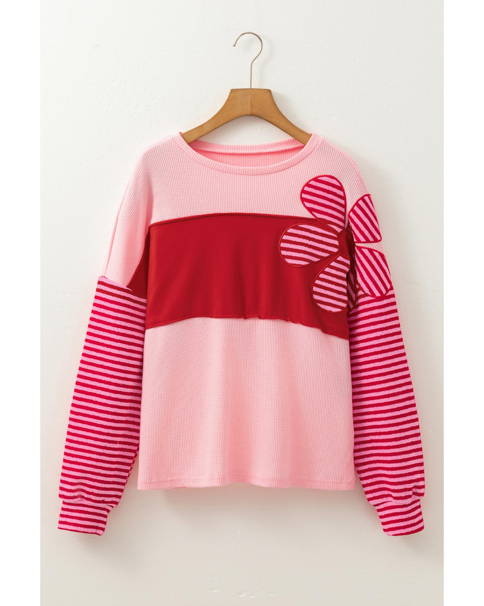 V539-AZEXDC25129506-P10-L-202508271106-00 Pink Floral Patch Color Block Striped Sleeve Textured Top - L - Image 1