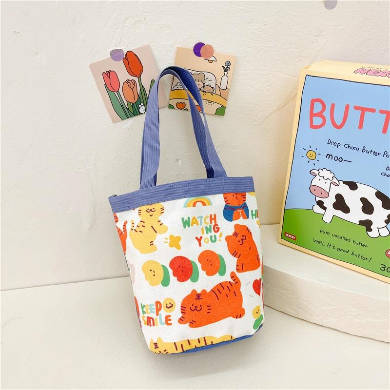 V562-4051124060DBT-202503041320-00 Cartoon Graffiti Bento Bag - Cute Canvas Handbag - Model 2 Blue - Image 1