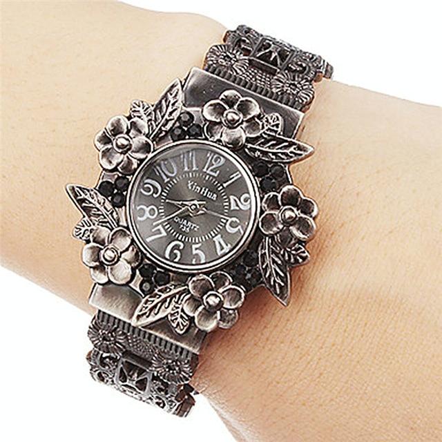 V562-A103779280DBT-227123-00 Flower Embossed Retro Bracelet Watch - Women Quartz - Black - Image 1