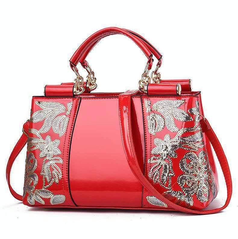 V562-A1088132060DBT-202503041335-00 Shiny Leather Handbag with Single-sided Embroidery - Red - Image 1