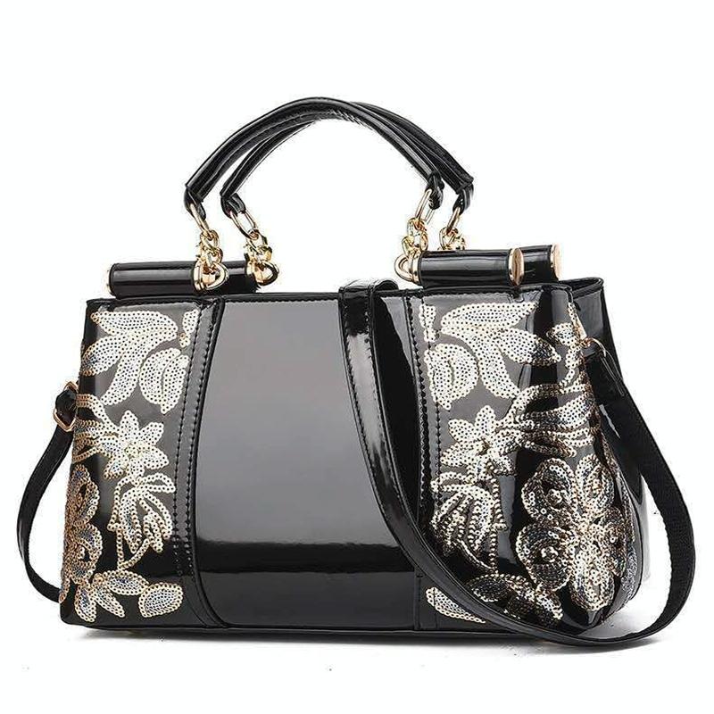 V562-C1088132060DBT-202503041335-00 Shiny Leather Handbag with Single-sided Embroidery - Black - Image 1