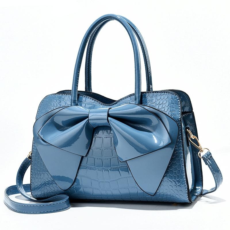 V562-D1040232060DBT-202504251552-00 Leather Ladies Handbag - Bright Bow Design - Blue - Image 1