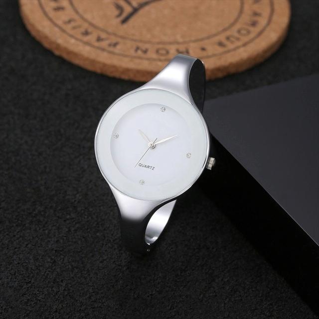 V562-E107029280DBT-202504171152-00 Minimalist Alloy Quartz Watch for Women - White Strap - Image 1