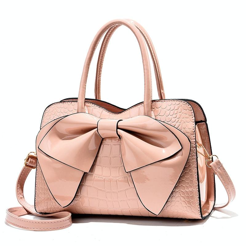 V562-G1040232060DBT-202504251548-00 Leather Ladies Handbag - Bright Bow Design - Pink - Image 1