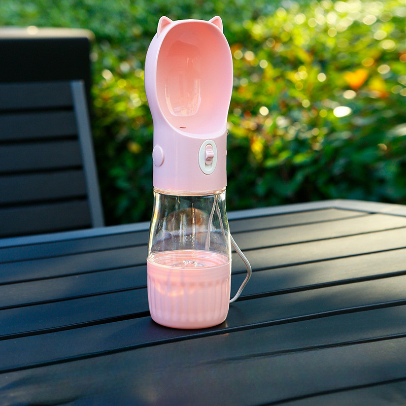 V888-ELOSUNG10146-204157-00 Pink Portable Dog Water Bottle with Built-in Bowl Dispenser - 250ml Water,180ml Food Capacity,Leak-proof for Travel and Walks - Image 1