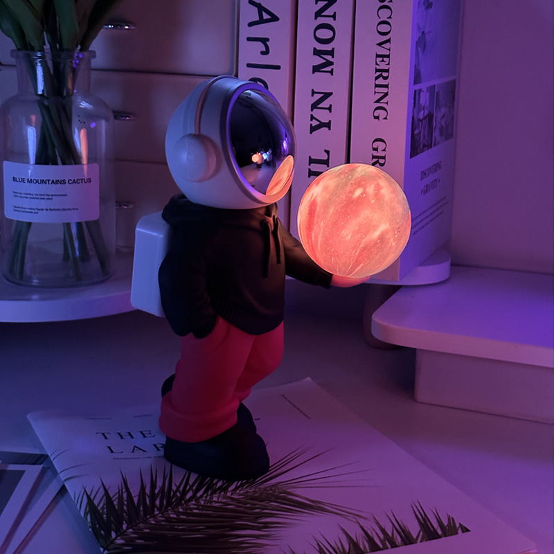 V888-ELOSUNG13500-211783-00 Holding the dreamy starry sky (black top + red pants) Creative Astronaut Bluetooth Speaker with 3D Starry Sky Lighting, Portable Wireless Moon Lamp Speaker - Perfect Gift for Space Enthusiasts - Image 1