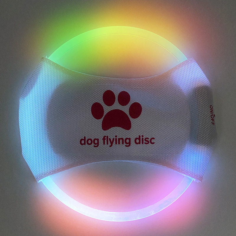 V888-ELOSUNG25411-202504281606-00 Colorful Light LED Rechargeable Dog Flying Disc - Glow-in-the-Dark Pet Training Toy with Paw Design - Image 1