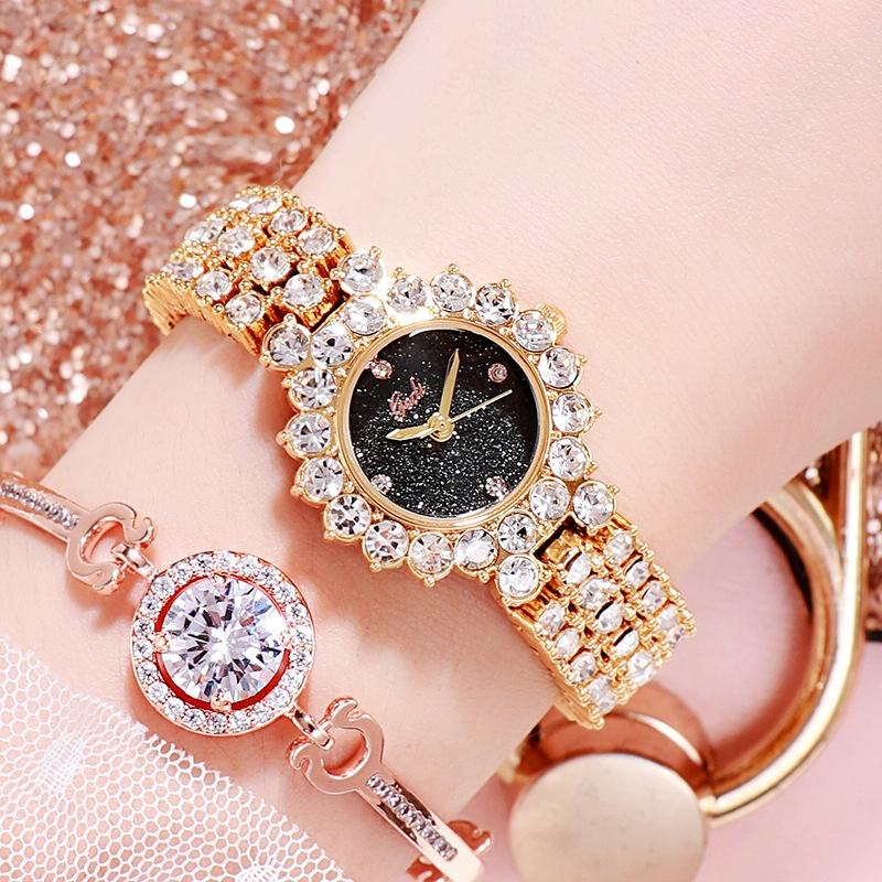 V562-J1051738550DBT-202508282136-00 Women Quartz Bracelet Watch with Diamond Accents - Golden Shell Black Plate - Image 1
